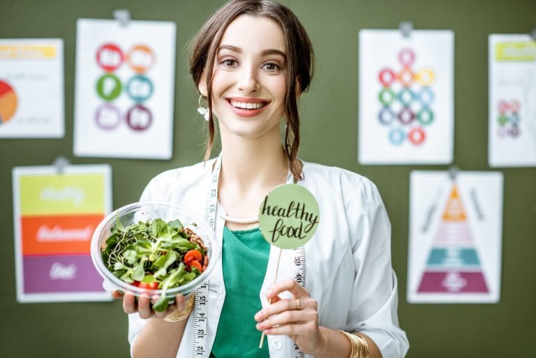 portrait-of-a-woman-dietitian-with-schemes-on-the-topic-of-nutrition-1536x1025-1-768x513